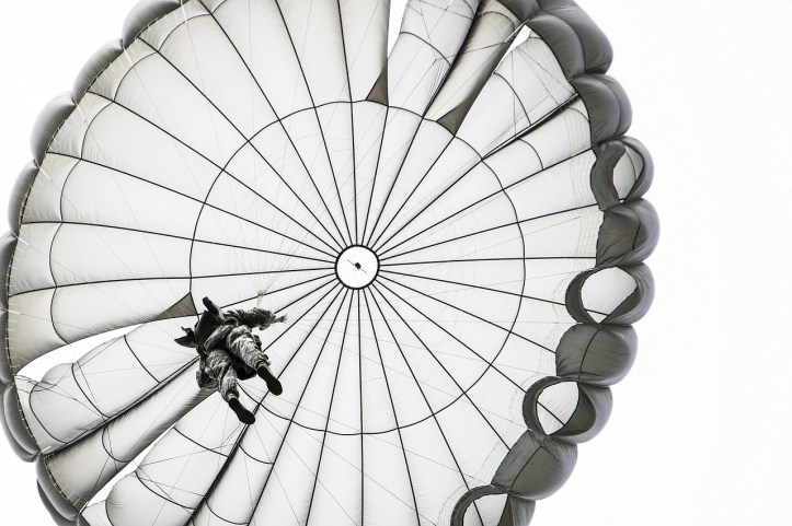 Parachutist by skeeze on Pixabay at https://pixabay.com/en/parachute-jump-opened-skydiving-900272/