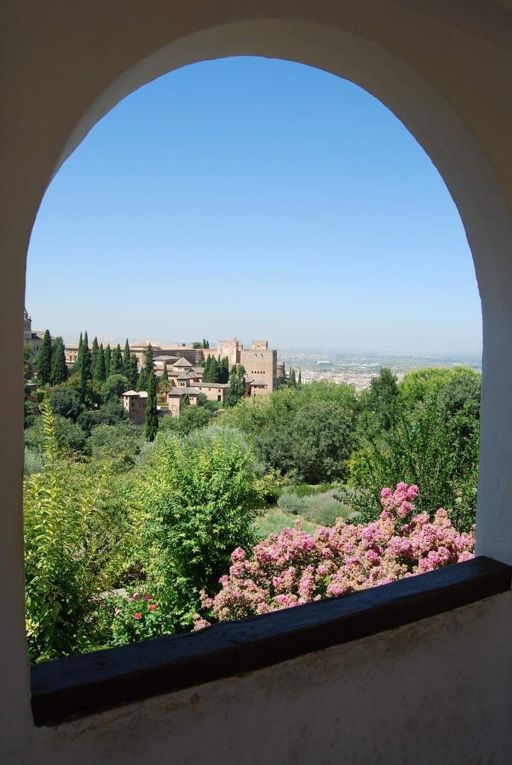 Scene of Granada through window by pcdazero on Pixabay at https://pixabay.com/en/granada-alhambra-spain-park-window-471751/