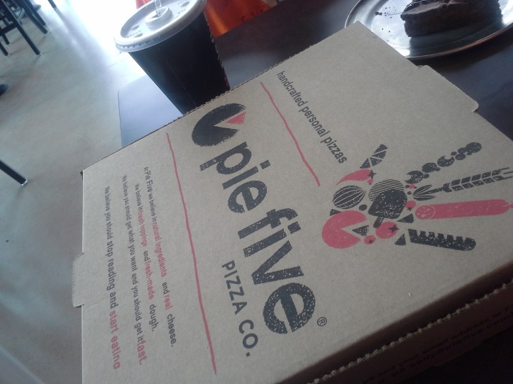 To-go box from Pie Five Pizza